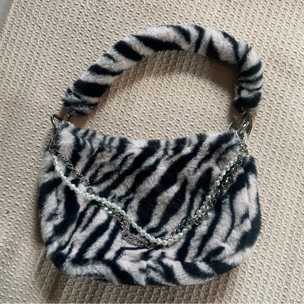 UO Faux Fur Pink Zebra Purse
